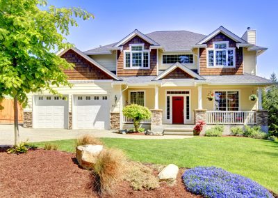 craftsman style home with red front door